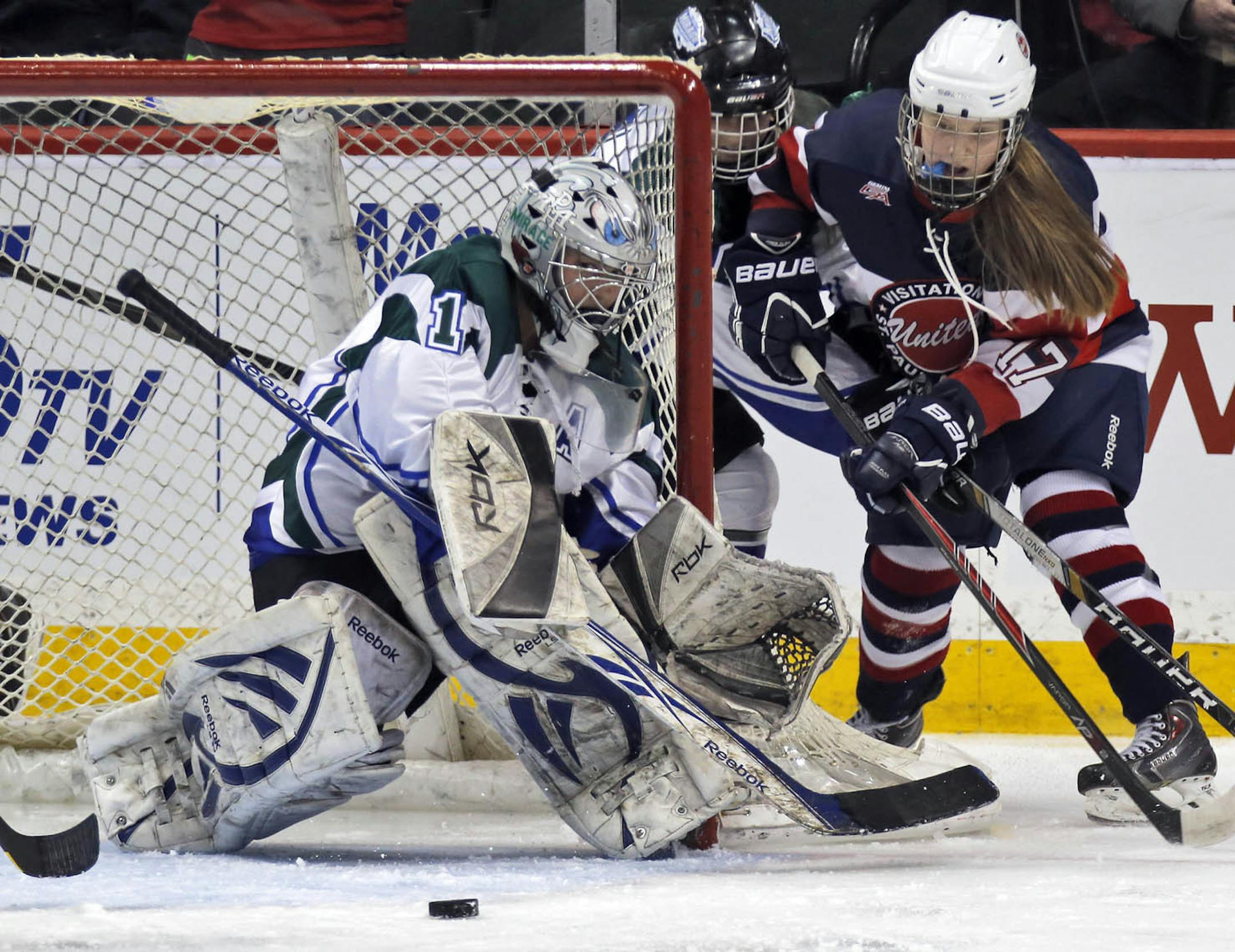 Girls Class 1A Hockey quarterfinals - St. Paul United vs. Proctor/Hermantown Mirage. United's Joie Phelps (17) attempted to slip the puck past Mirage goalie Kylie Hommerding. (MARLIN LEVISON/STARTRIBUNE(mlevison@startribune.com)