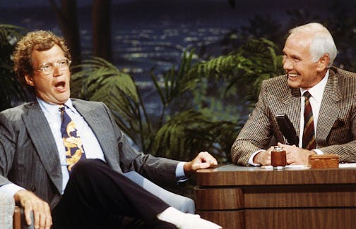 FILE - In this Aug. 30, 1991 file photo, "Late Night with David Letterman" host David Letterman, left, appears with host Johnny Carson during taping of "The Tonight Show," at the NBC Studio in Burbank, Calif. After 33 years in late night and 22 years hosting CBS' "Late Show," Letterman will retire on May 20. (AP Photo/Bob Galbraith, File) ORG XMIT: MIN2015052014594859