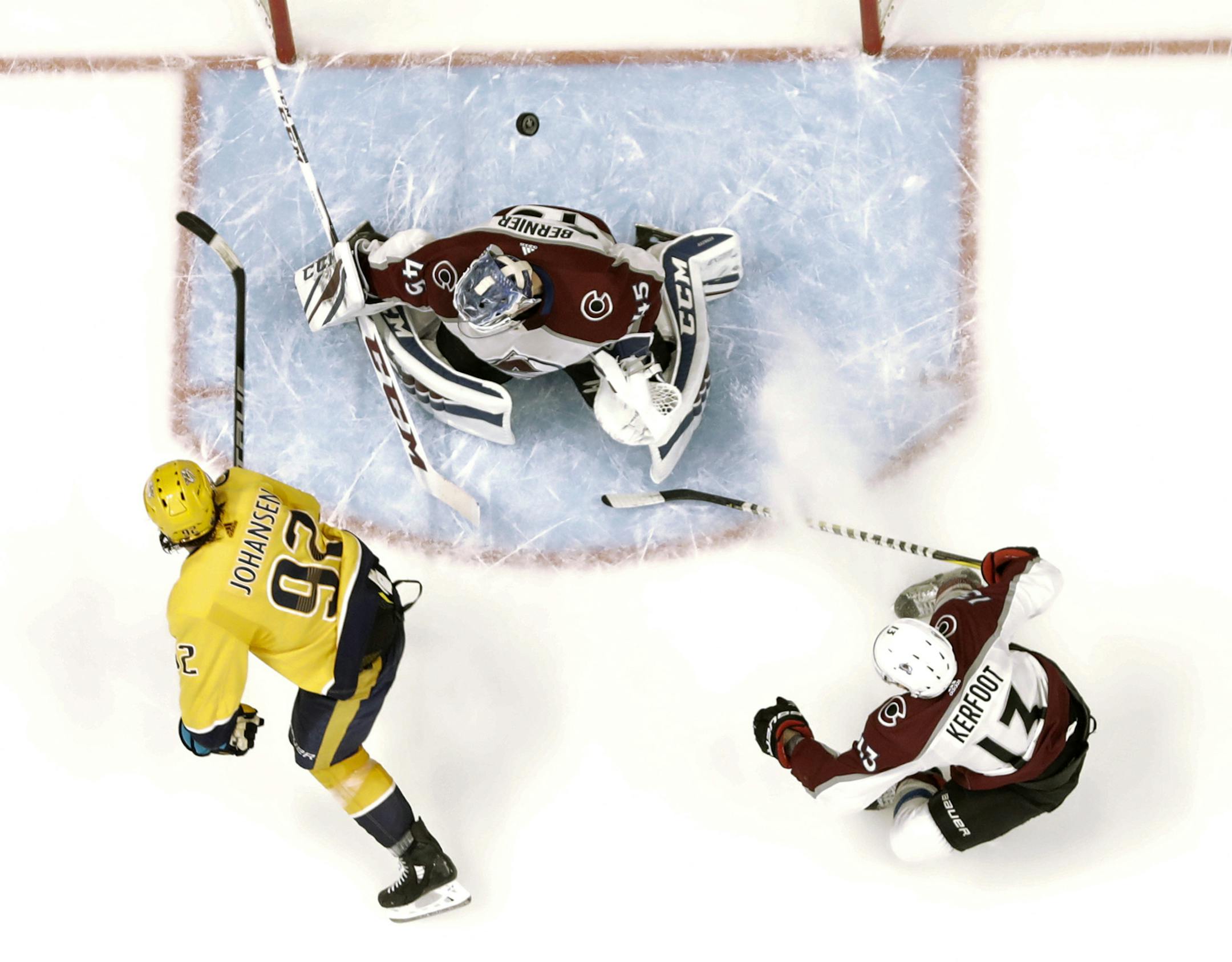 Nashville Predators center Ryan Johansen (92) scores a goal against Colorado Avalanche goaltender Jonathan Bernier (45) during the second period in Game 2 of an NHL hockey first-round playoff series Saturday, April 14, 2018, in Nashville, Tenn. At right is Avalanche center Alexander Kerfoot (13). The Predators won 5-4 to take a 2-0 lead in the series. (AP Photo/Mark Humphrey)