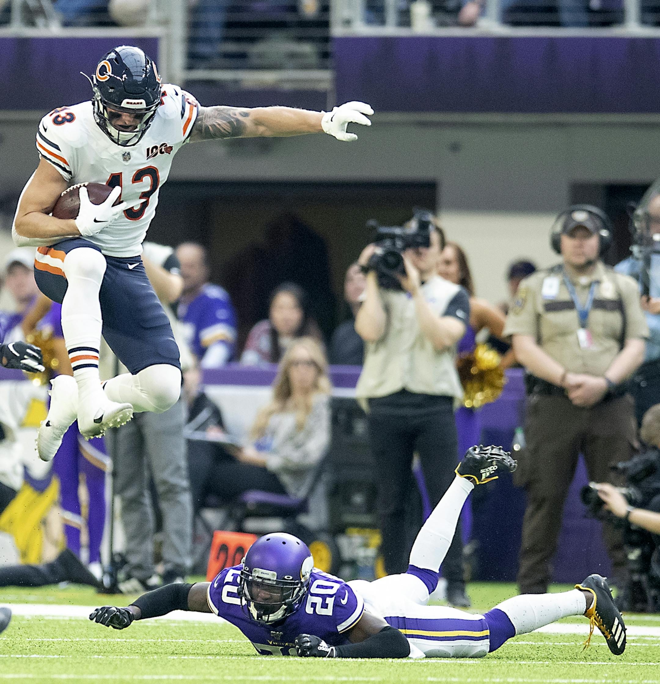 Chicago Bears tight end Eric Saubert leaped over Minnesota Vikings cornerback Mackensie Alexander in the second quarter.