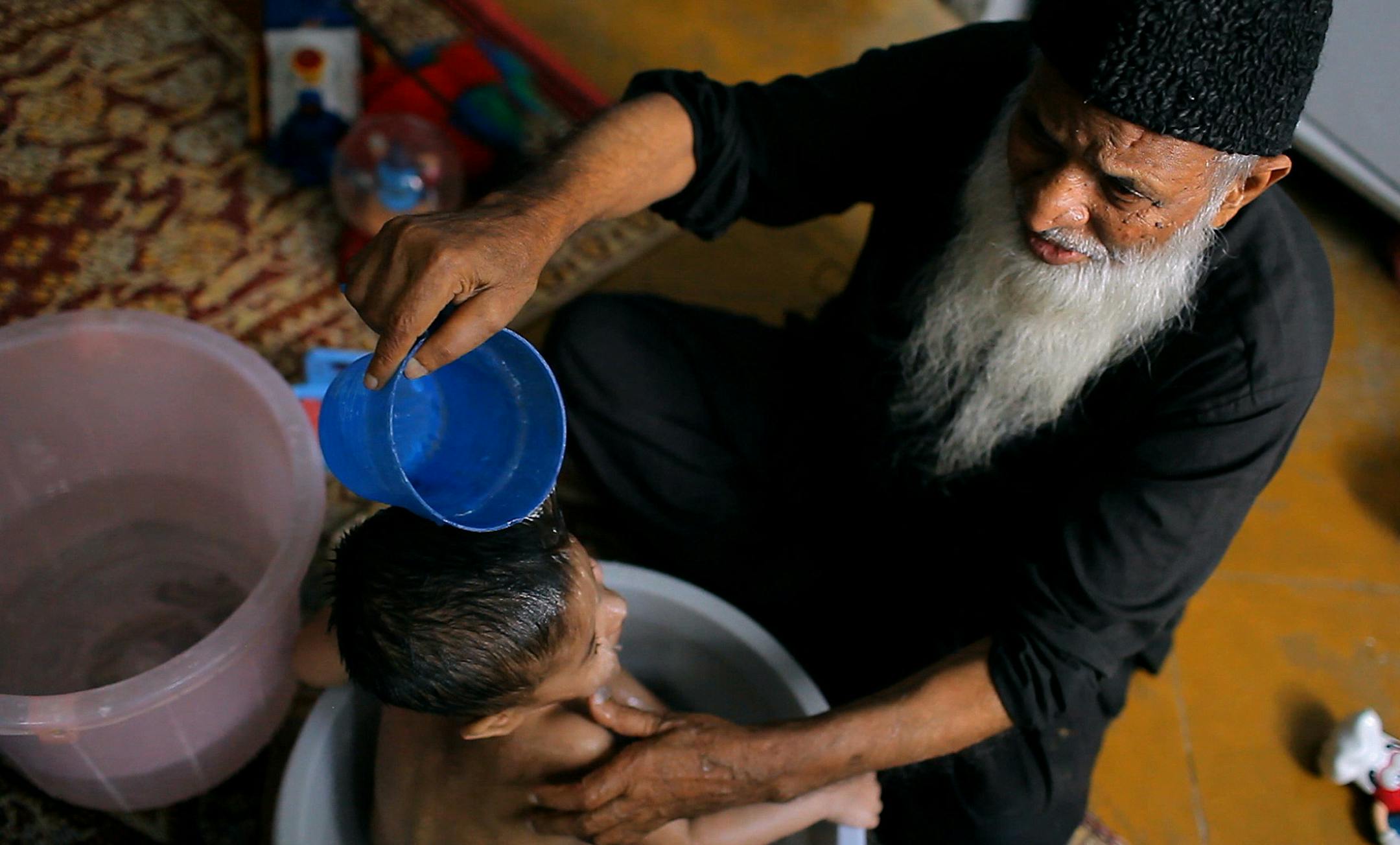 Abdul Sattar Edhi in a scene from THESE BIRDS WALK, a film by Omar Mullick and Bassam Tariq. Image courtesy of Oscilloscope Laboratories.