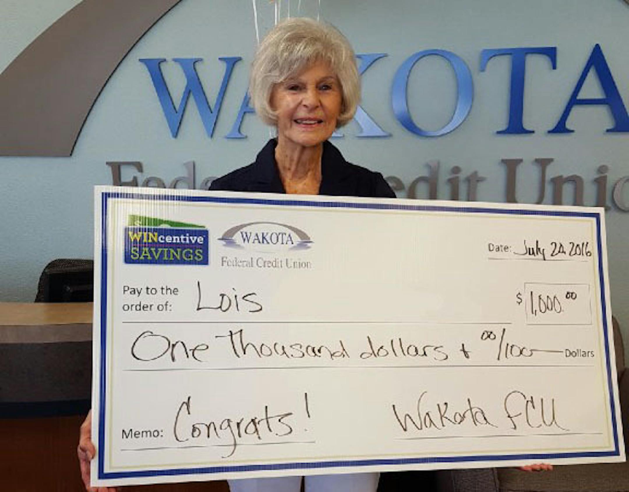 Lois Ninnemann, who won $1,000 in June from the WINcentive Savings Program. The presentation occurred at Wakota Federal Credit Union in South St. Paul.