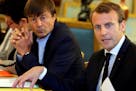 In this Sept.5 2017 photo, French President Emmanuel Macron, right, and Environment Minister Nicolas Hulot meet with NGOs to discuss climate and envir