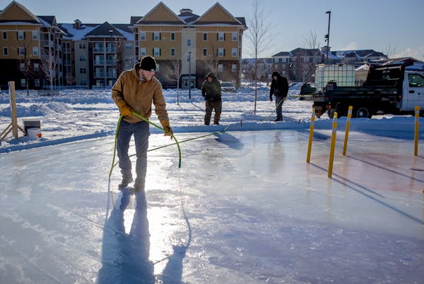 Sam McNellis, a member of Maple Grove’s maintenance crew, worked on the ice of the city’s Crokicurl rink on Thursday. Maple Grove is the first cit