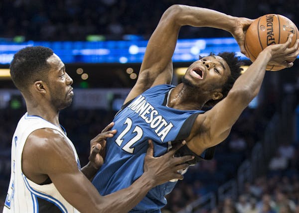Minnesota Timberwolves forward Andrew Wiggins (22) is defended by Orlando Magic forward Jeff Green during the first half of an NBA basketball game in 