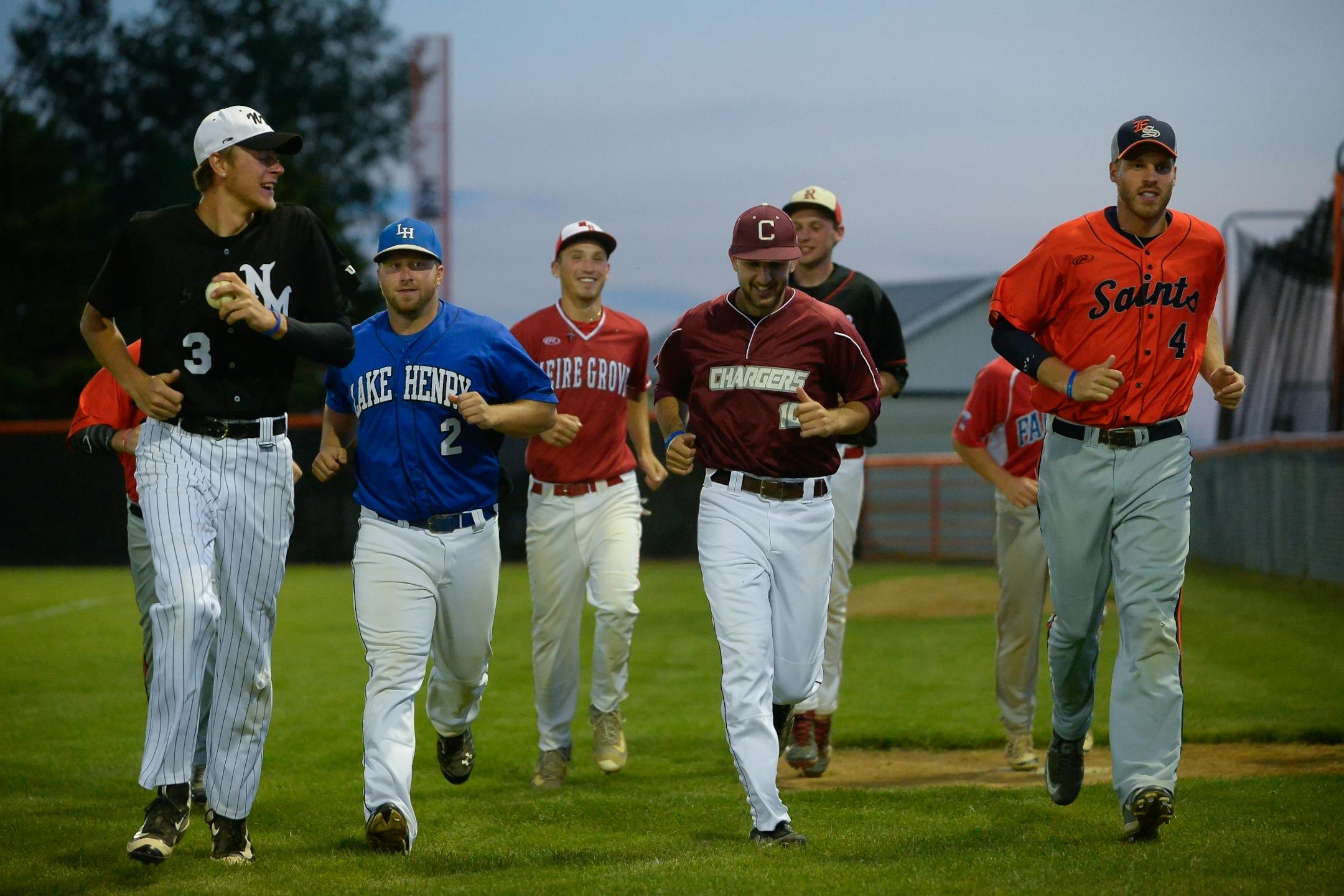 Pitchers on the roster for the Stearns County League all-star team jogged to the edge of the outfield and back to the dugout to stay loose during their game against the County Line League on Friday, June 30, 2017 in Elrosa, Minn .