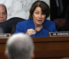 Senate Judiciary Committee member Sen. Amy Klobuchar, D-Minn. questions Supreme Court Justice nominee Neil Gorsuch, foreground, on Capitol Hill in Was