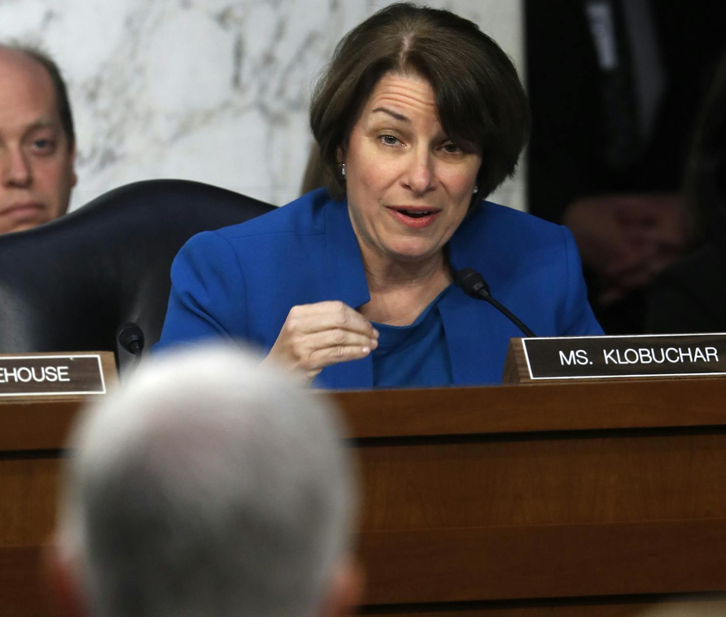 Senate Judiciary Committee member Sen. Amy Klobuchar, D-Minn. questions Supreme Court Justice nominee Neil Gorsuch, foreground, on Capitol Hill in Washington, Tuesday, March 21, 2017, during the committee's confirmation hearing for Gorsuch. (AP Photo/Pablo Martinez Monsivais) ORG XMIT: MIN2017032115574728