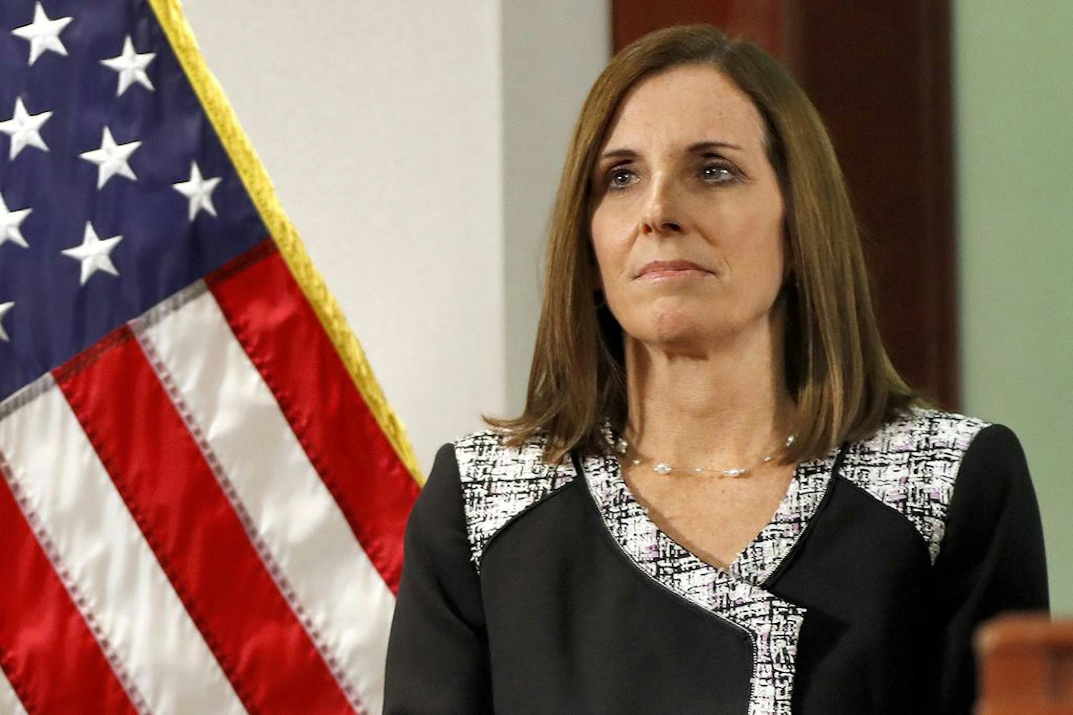 FILE - In this Dec. 18, 2018 file photo, then Rep. Martha McSally, R-Ariz., waits to speak during a news conference at the Capitol in Phoenix. Sen. Martha McSally, R-Ariz., the first female fighter pilot to fly in combat, says she was raped in the Air Force by a superior officer.