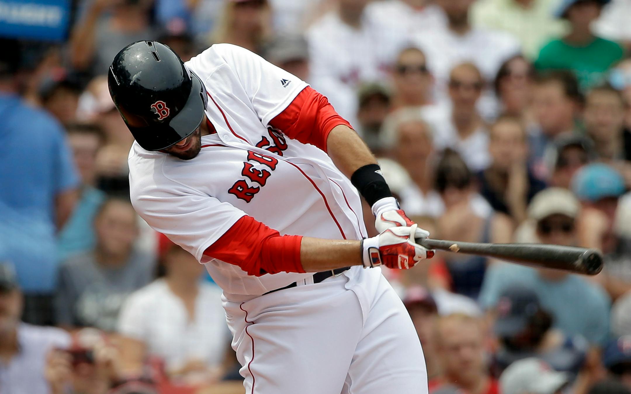 Boston Red Sox's J.D. Martinez hits an RBI-double off a pitch by Minnesota Twins' Jose Berrios in the second inning of a baseball game, Sunday, July 29, 2018, in Boston. (AP Photo/Steven Senne)