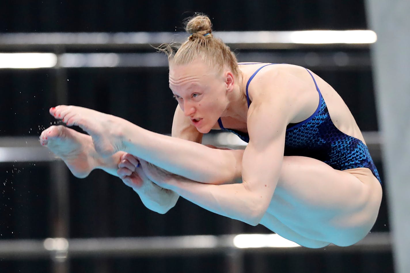 Bacon Sarah of the United States performs a dive during the women's 3-meter springboard final at the FINA Diving World Cup in Tokyo, Tuesday, May 4, 2021. Bacon won the silver medal in the event. (AP Photo/Koji Sasahara)