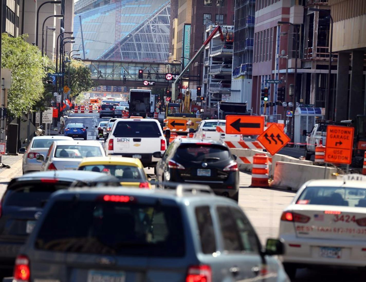 Heavy traffic on 4th Street S. headed toward U.S. Bank Stadium caused delays in downtown Minneapolis in 2015. The city expects will begin work on the west end of the street in 2019.