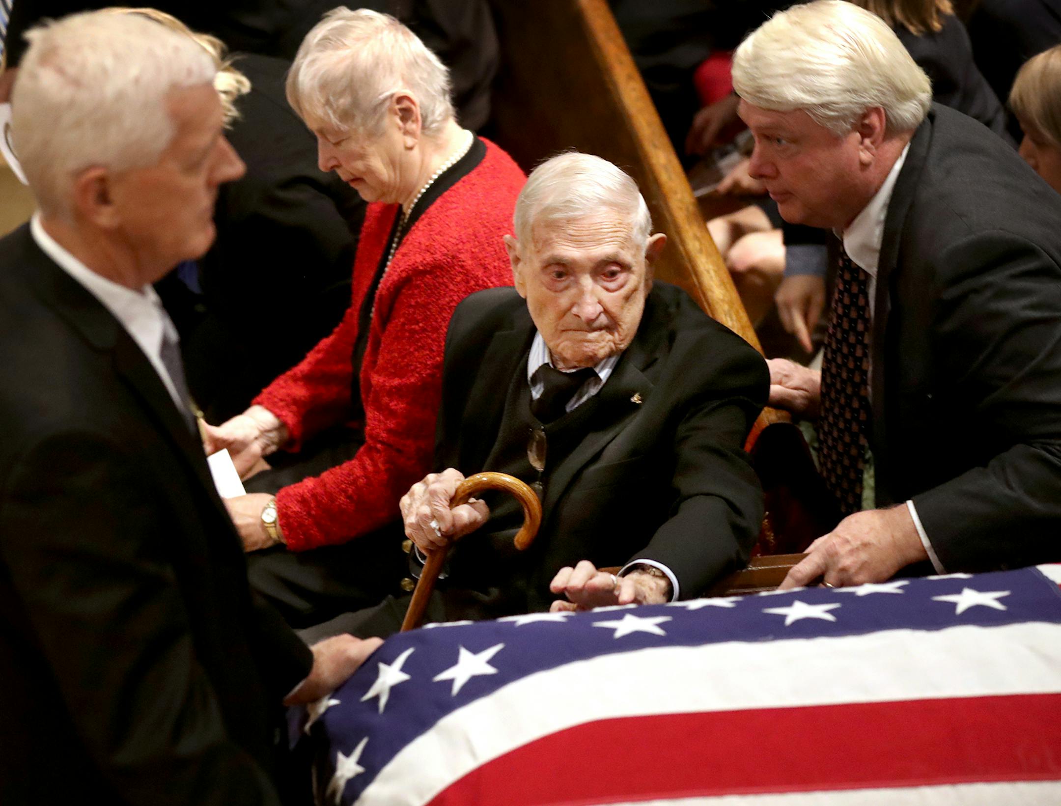Harold Gifford touched the passing casket of his brother Quentin Gifford after Saturday's service at Fort Snelling Memorial Chapel. Quentin died at Pearl Harbor.