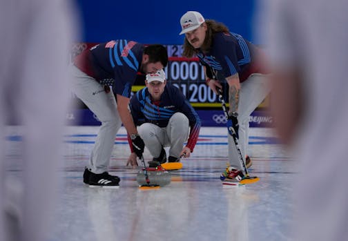 United States' John Shuster, directs his teammates, after throwing a rock, during the men's curling match against the Russian Olympic Committee, at the 2022 Winter Olympics, Wednesday, Feb. 9, 2022, in Beijing. (AP Photo/Nariman El-Mofty)