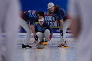 United States' John Shuster, directs his teammates, after throwing a rock, during the men's curling match against the Russian Olympic Committee, at th