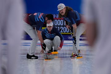 United States' John Shuster, directs his teammates, after throwing a rock, during the men's curling match against the Russian Olympic Committee, at th