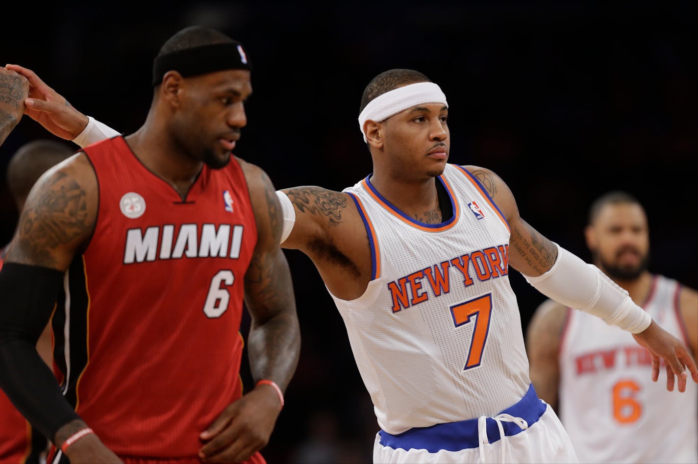 LeBron James, left, and Carmelo Anthony are the top prizes in free agency, which began Tuesday night.