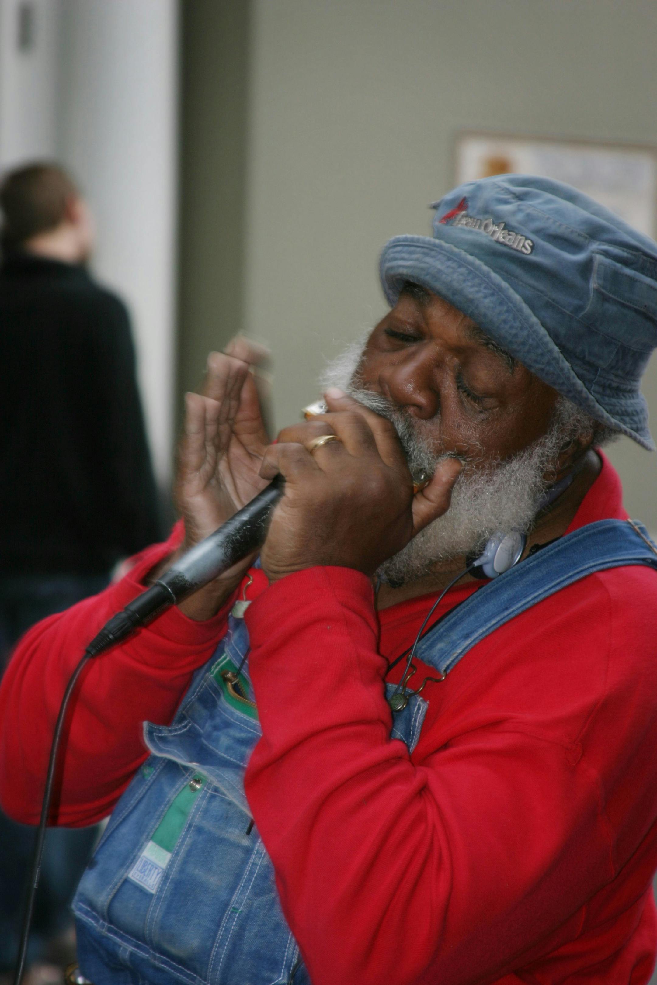 A harmonica player peforms in the French Quarter on Royal Street in New Orleans, Louisiana.
