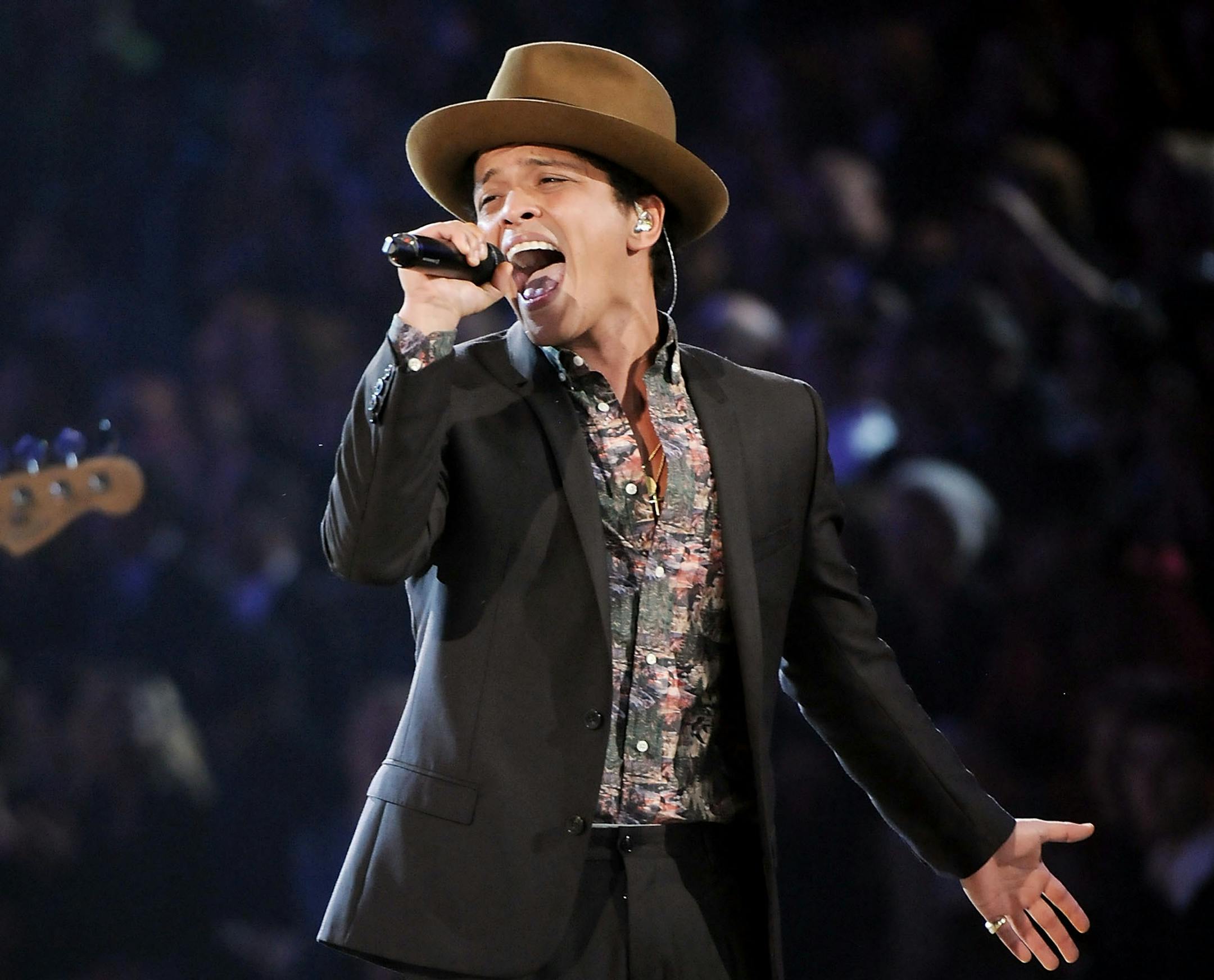 FILE - This Nov. 7, 2012 file photo shows Bruno Mars performing during the 2012 Victoria's Secret Fashion Show in New York. Sting, Rihanna and Bruno Mars will hit the stage for a special performance at next week's Grammy Awards. The Recording Academy announced Monday, Feb. 4, 2013, that they will perform together at the Feb. 10 awards show. Triple nominee Kelly Clarkson will also take the stage. (Photo by Evan Agostini/Invision/AP) ORG XMIT: MIN2013022016594866 ORG XMIT: MIN1302201703015189