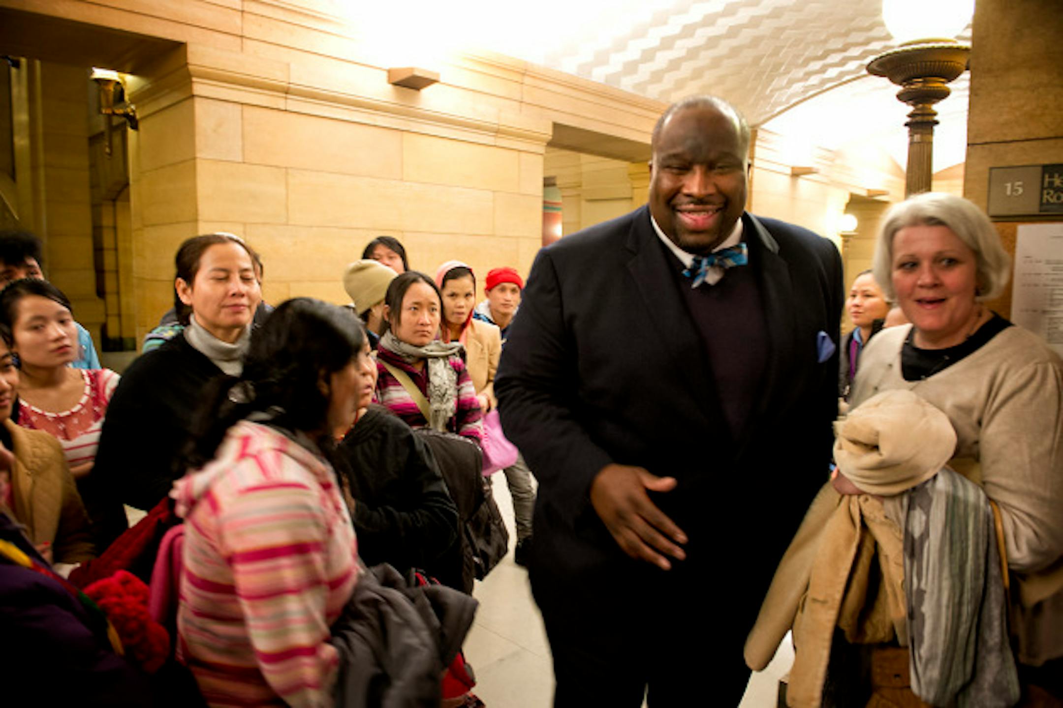 Senator Jeff Hayden greeted the group as he headed into a hearing.  50 refugees from Burma and Nepal who attend the M.O.R.E. Multicultural School for Empowerment in St. Paul toured the Capitol  Monday, March 4, 2013.  They were there to lobby legislators in the school's district for bills on the minimum wage and education funding.  They also received a first hand civics lesson on who the the Governor is, what the U.S. and state flags represent and how to say the work elevator.   ]   GLEN STUBBE * gstubbe@startribune.com