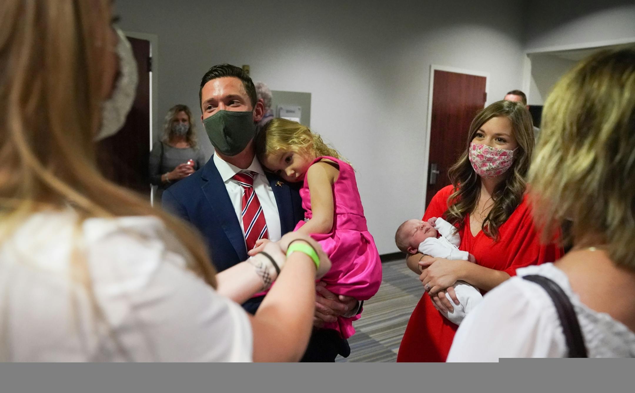 Tyler Kistner held his daughter Elodie and wife Marie held Gabriel as they talked with supporters and staff in their war room before speaking at the event. MNGOP Election Night Party at the DoubleTree Hotel in Bloomington.