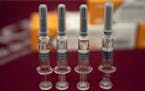 Syringes of SARS CoV-2 Vaccine for COVID-19 produced by SinoVac are displayed during a media tour of its factory in Beijing on Thursday, Sept. 24, 202