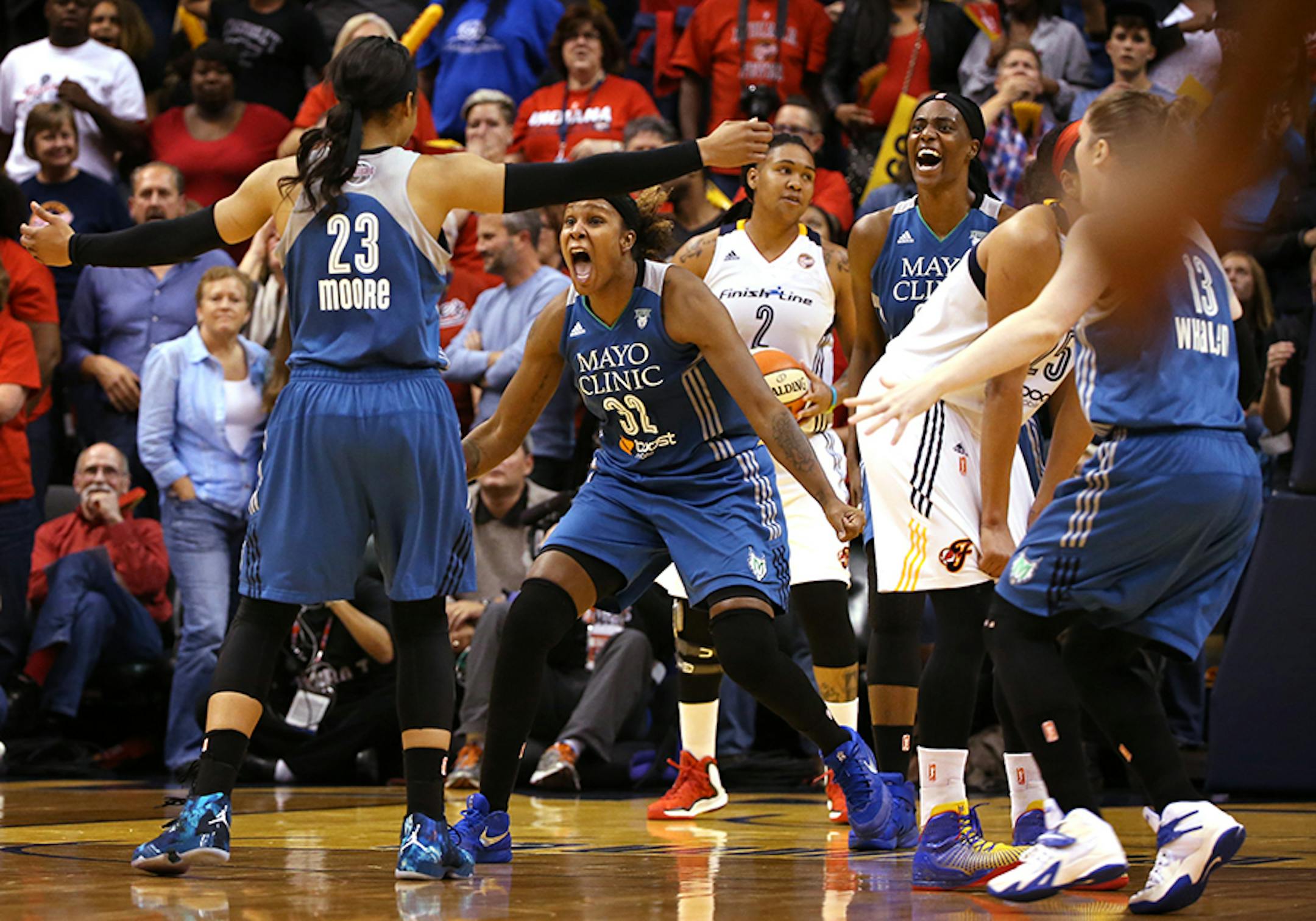 Minnesota Lynx forward Maya Moore (23) celebrates with Minnesota Lynx forward Rebekkah Brunson (32) after making the game winning three point shot at the buzzer.