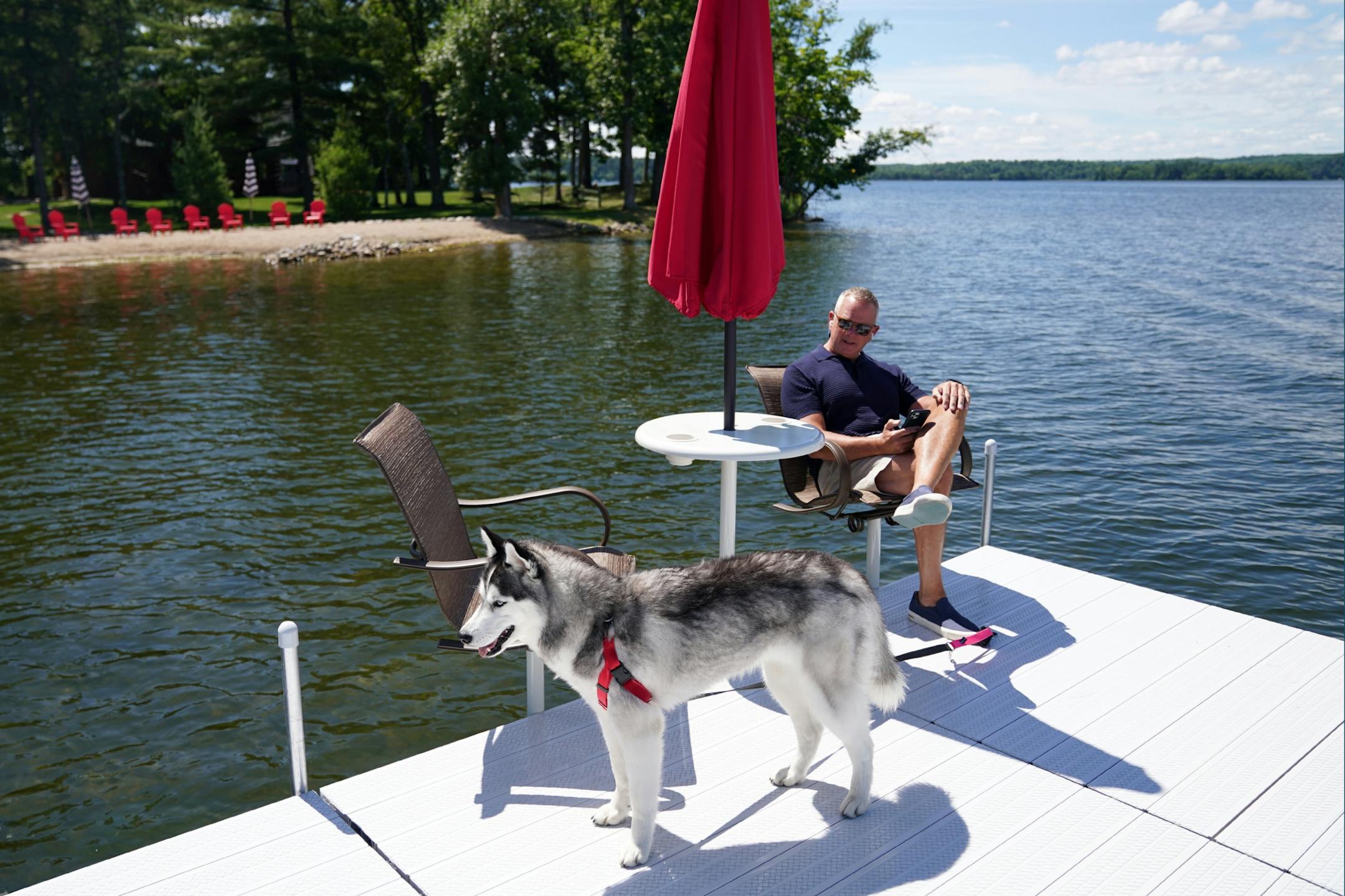 Todd Russell, a commercial real estate consultant from St. Paul, sat Thursday afternoon at the end of his dock where he often takes conference calls with his 1-year-old Siberian Husky Isabelle.