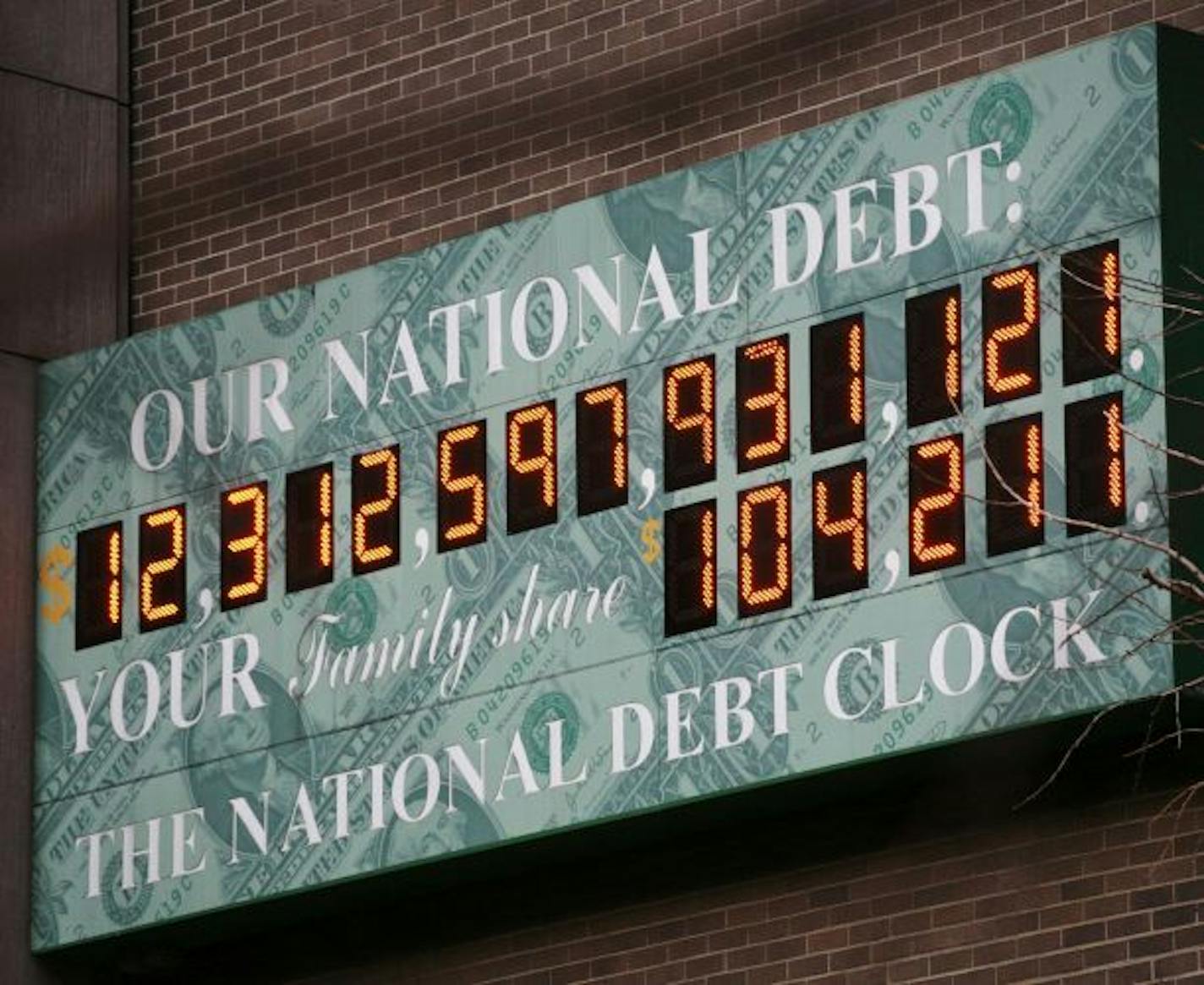 FILE - This Feb. 1, 2010, file photo shows the National Debt Clock in New York. The budget President Barack Obama submitted to Congress this month proposes record spending of $3.8 trillion for 2011. Taxes in next year's budget will support only $2.5 trillion of that spending, leaving $1.3 trillion to be borrowed. The Debt Clock is a privately funded estimate of the national debt.