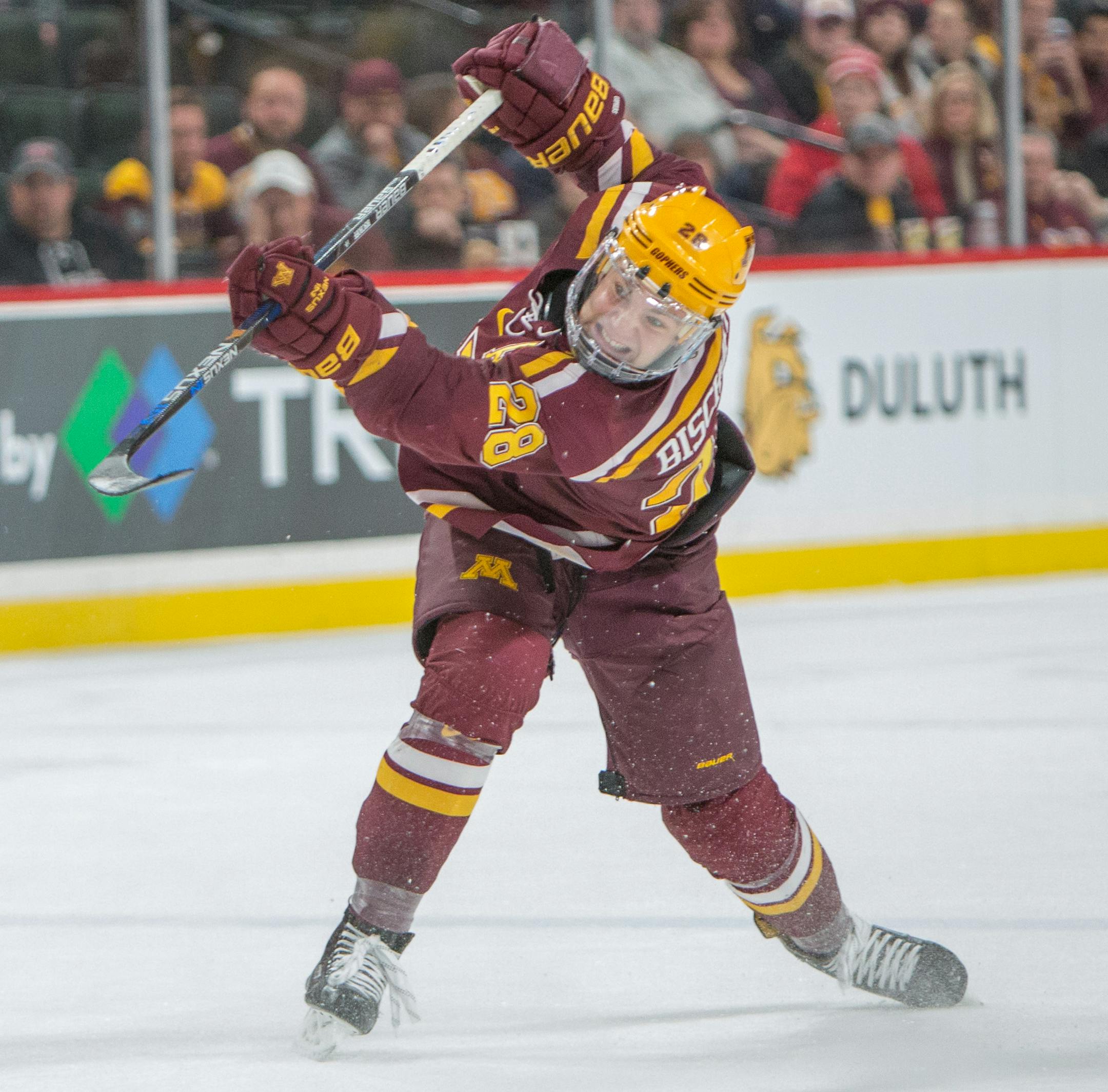 Minnesota Gophers defenseman Jake Bischoff (28) shoots the puck, teammate Brent Gates Jr. (10) would burry the rebound with 39 seconds left in the game. Gophers fall to UMD Bulldogs 3-2. [ Special to Star Tribune, photo by Matt Blewett, Matte B Photography, matt@mattebphoto.com, January 27, 2017, Minnesota Golden Gophers, University of Minnesota Duluth (UMD) Bulldogs, North Star College Cup, Xcel Energy Center, St. Paul, Minnesota, SAXO 20046998A UPUK012817