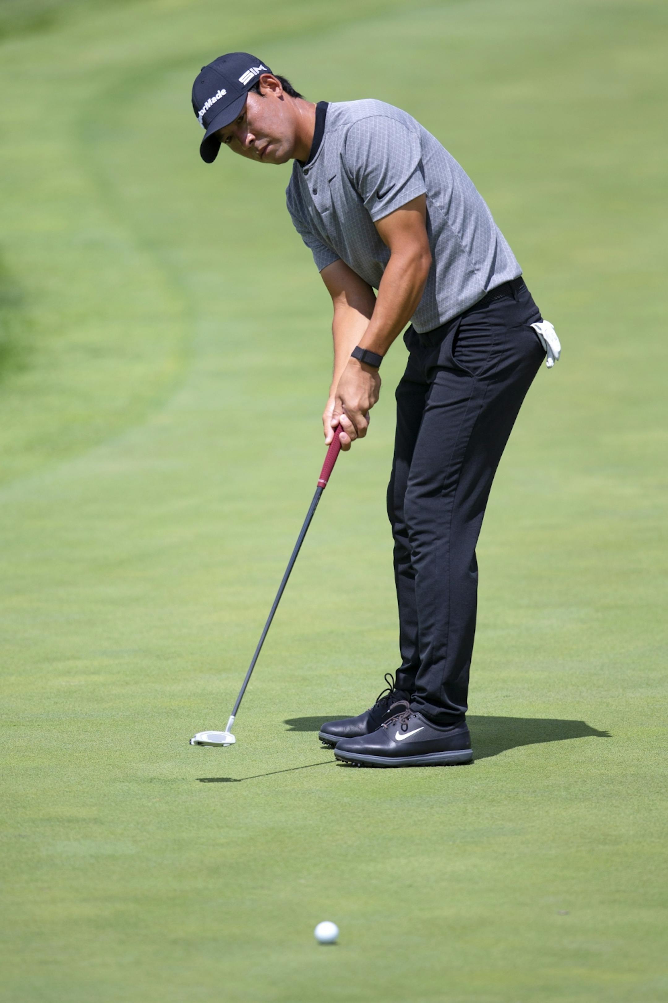 Xinjun Zhang putts on the ninth hole during the first round of the 3M Open golf tournament in Blaine, Minn., Thursday, July 23, 2020.