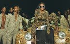 This image released by Disney Plus shows Beyonce Knowles, center, in a scene from her visual album "Black is King." (Travis Matthews/Disney Plus via A