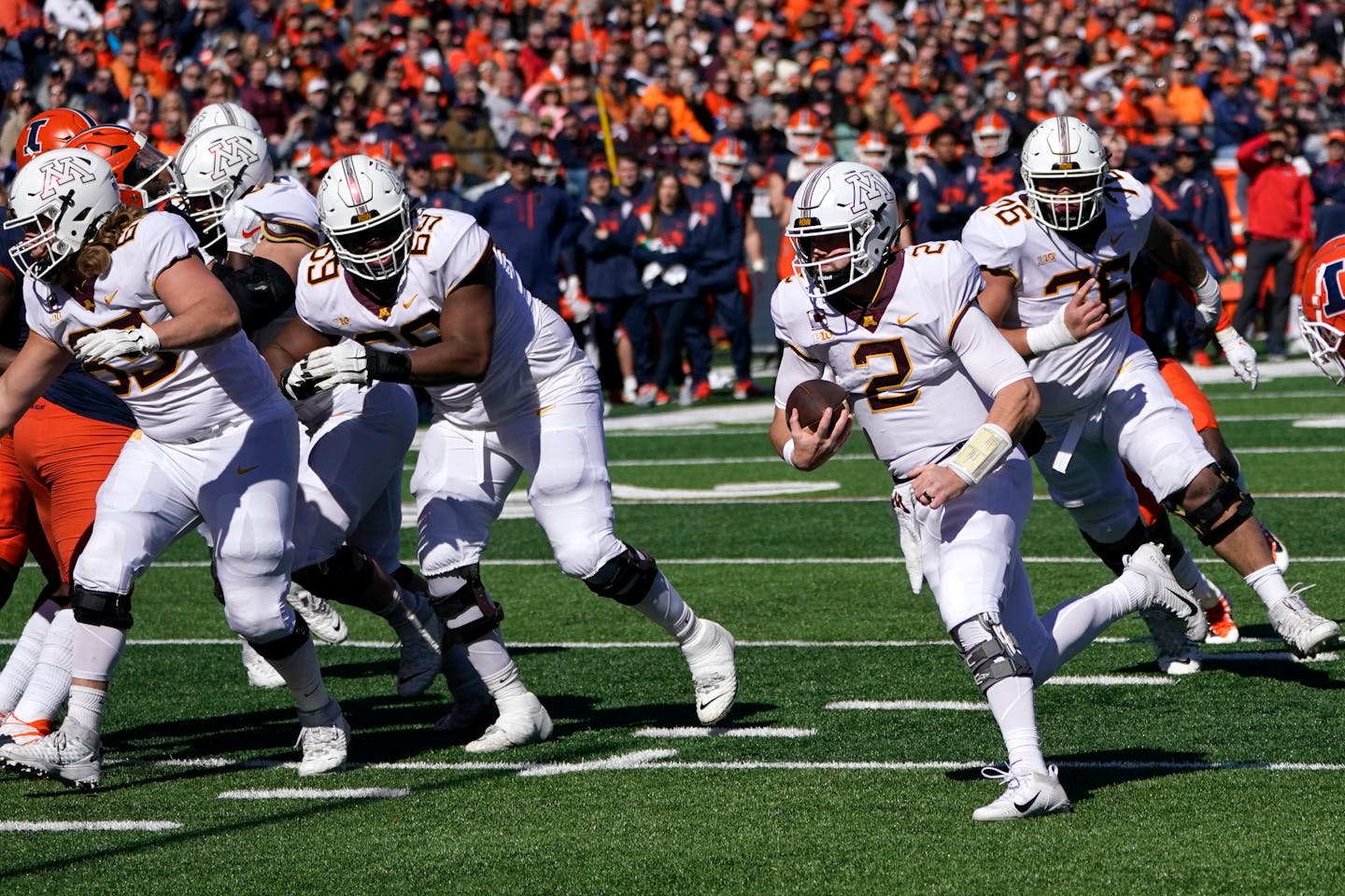 Minnesota quarterback Tanner Morgan heads to the end zone for a touchdown during a NCAA college football game against Illinois Saturday, Oct. 15, 2022, in Champaign, Ill. Illinois won 26-14. (AP Photo/Charles Rex Arbogast)