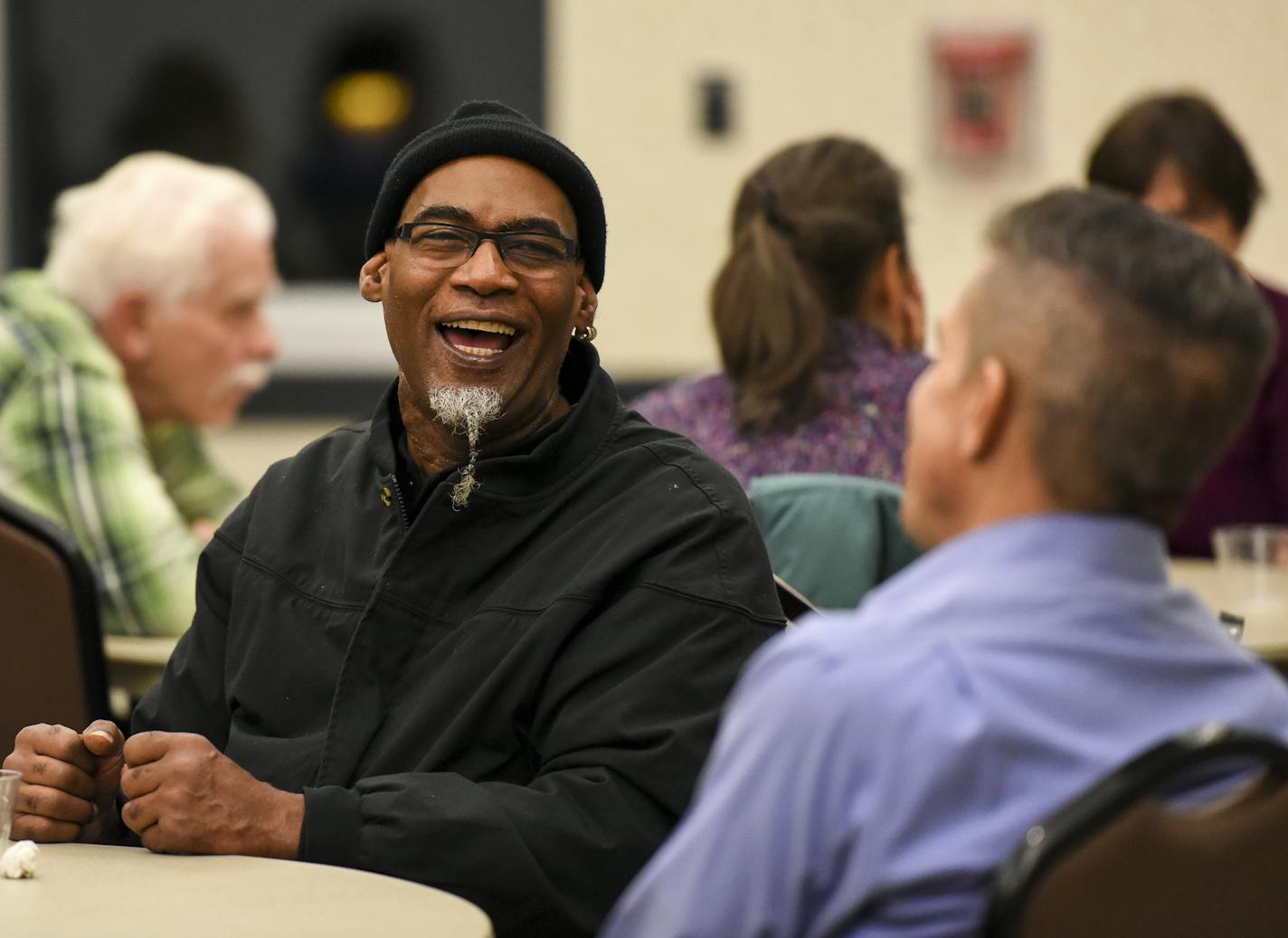 Anthony Mills, of Coon Rapids, shared a laugh with Coon Rapids Police Chief Brad Wise during November's "Transformative Circle" discussion at the Coon Rapids Civic Center Thursday. ] Aaron Lavinsky &#x2022; aaron.lavinsky@startribune.com On the first Thursday of every month, the Coon Rapids Civic Center opens up for a pot luck dinner that aims to bring a diverse group of neighbors together and get them talking to each other - across many divides. It's called Transformative Circle, and organizers