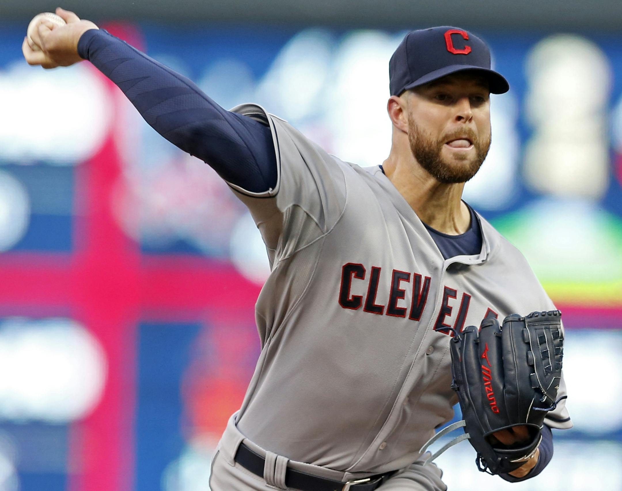 Cleveland Indians pitcher Corey Kluber throws against the Minnesota Twins in the first inning of a baseball game, Friday, April 17, 2015, in Minneapolis. (AP Photo/Jim Mone)