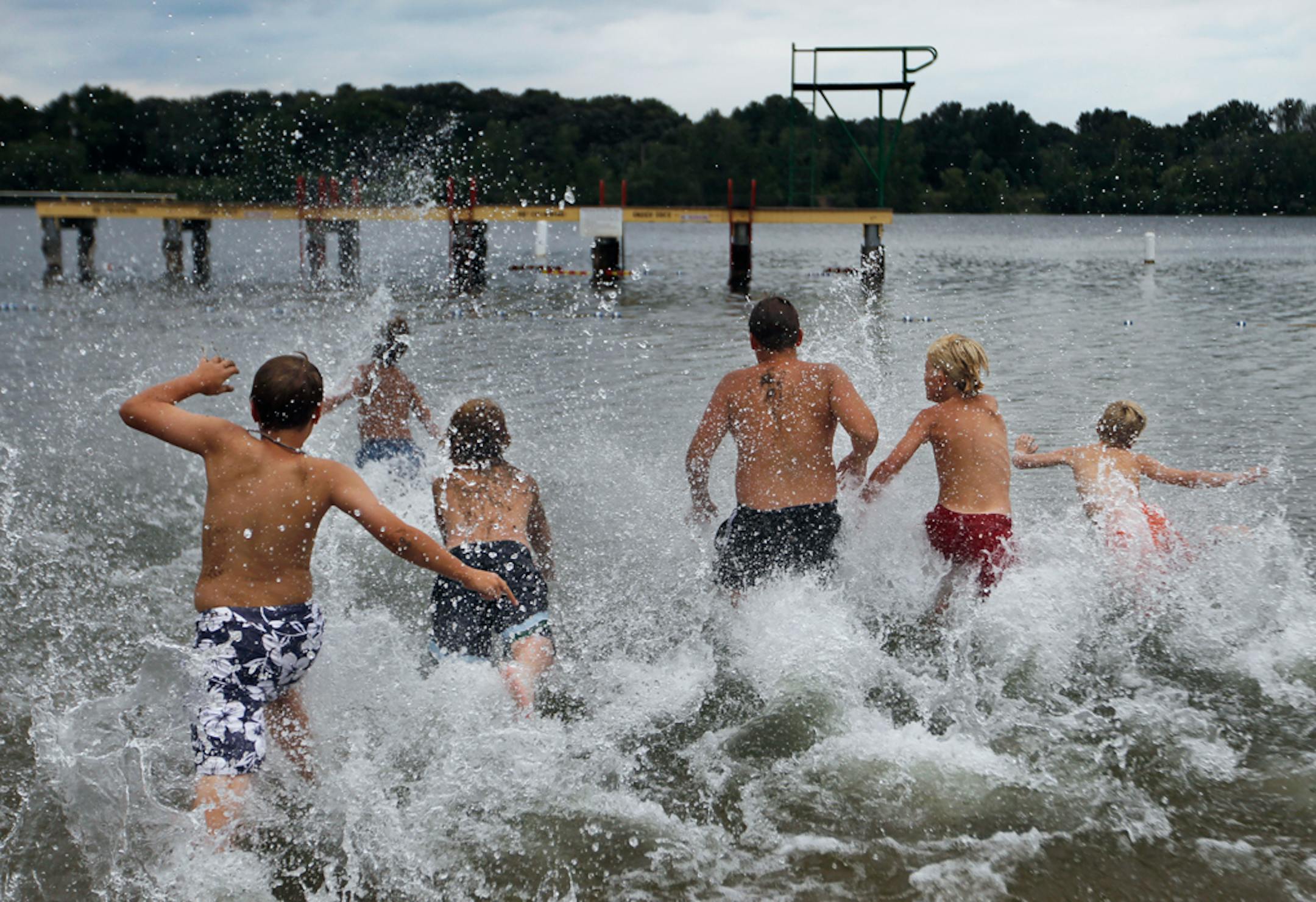 At Shady Oak Beach, a whistle marks the end of a break and a dash to the diving platform for (from left) Sam McDonough, Griffin Lundquist, A.J. Jacobson, Jack Piazza and Mike Piazza.