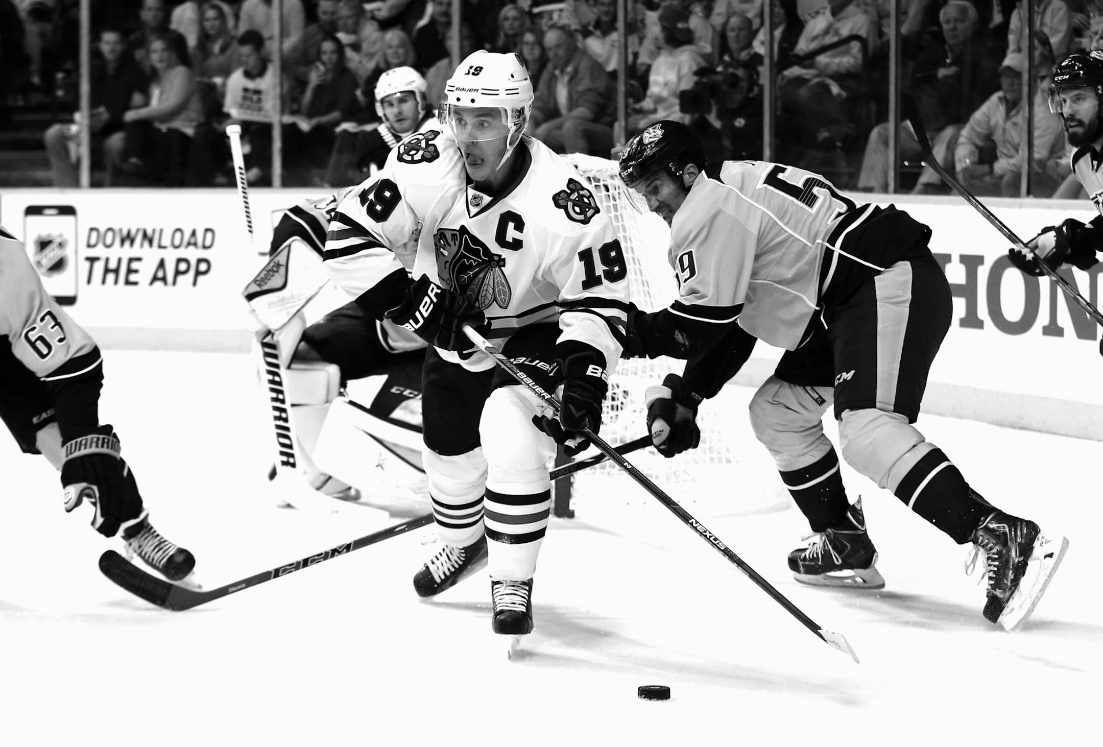 The Chicago Blackhawks' Jonathan Toews (19) gets the puck away from the Nashville Predators' Roman Josi (59) during the first period during Game 2 in the first round of the NHL playoffs at Bridgestone Arena in Nashville, Tenn., on Friday, April 17, 2015. (Nuccio DiNuzzo/Chicago Tribune/TNS)