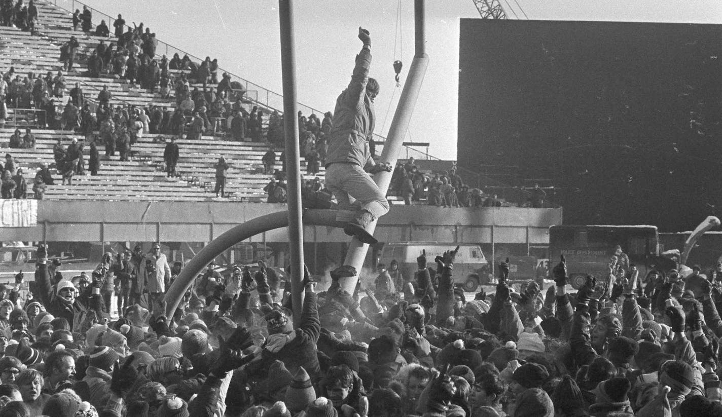 The goal posts at Metropolitan Stadium are tipped at precarious angle as happy Minnesota Vikings fans work to bring them down following the Vikings win over the Cleveland Browns in Minneapolis, Jan. 4, 1970, 27-7, for the NFL title. (AP Photo) ORG XMIT: APHS448519