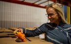 Produce strategy manager Heidi Coe was amused by the appearance of an oddly shaped carrot at Second Harvest Heartland's Brooklyn Park warehouse.
