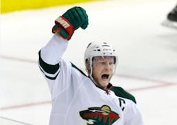 Minnesota Wild center Mikko Koivu celebrates his goal during overtime in Game 5 against the Dallas Stars in the first round of the NHL Stanley Cup pla