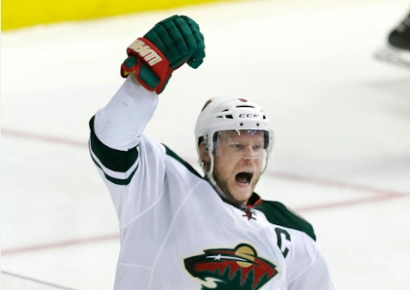 Minnesota Wild center Mikko Koivu celebrates his goal during overtime in Game 5 against the Dallas Stars in the first round of the NHL Stanley Cup playoffs Friday, April 22, 2016, in Dallas. The Wild won 5-4.