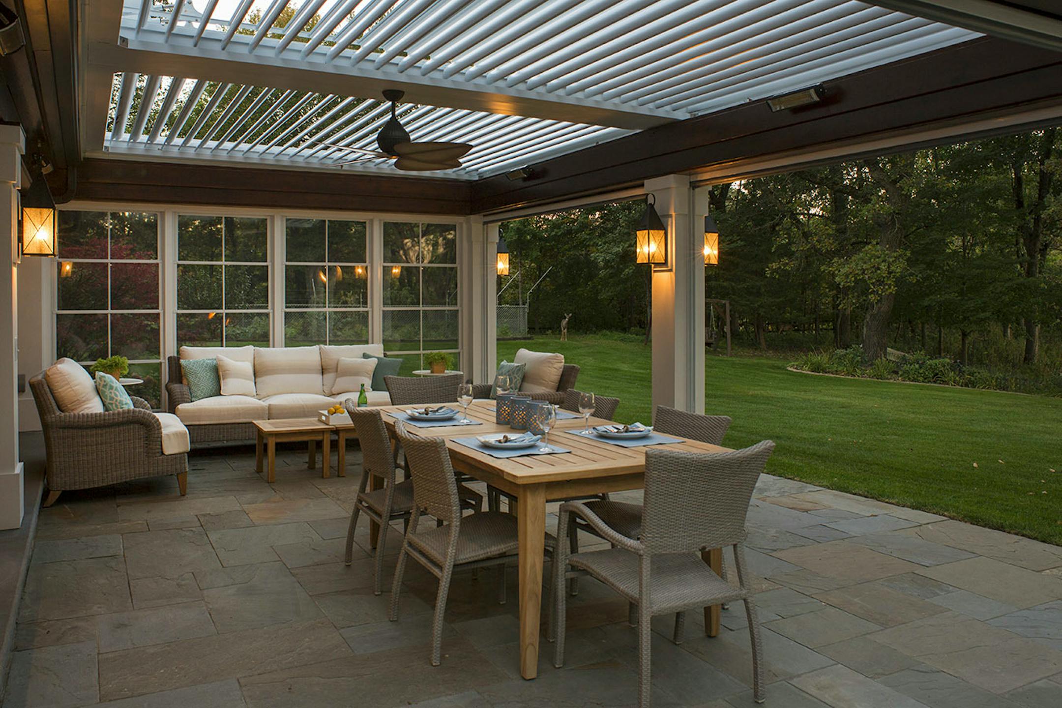 The porch has screen and vinyl panel "walls" that can be rolled up or down.