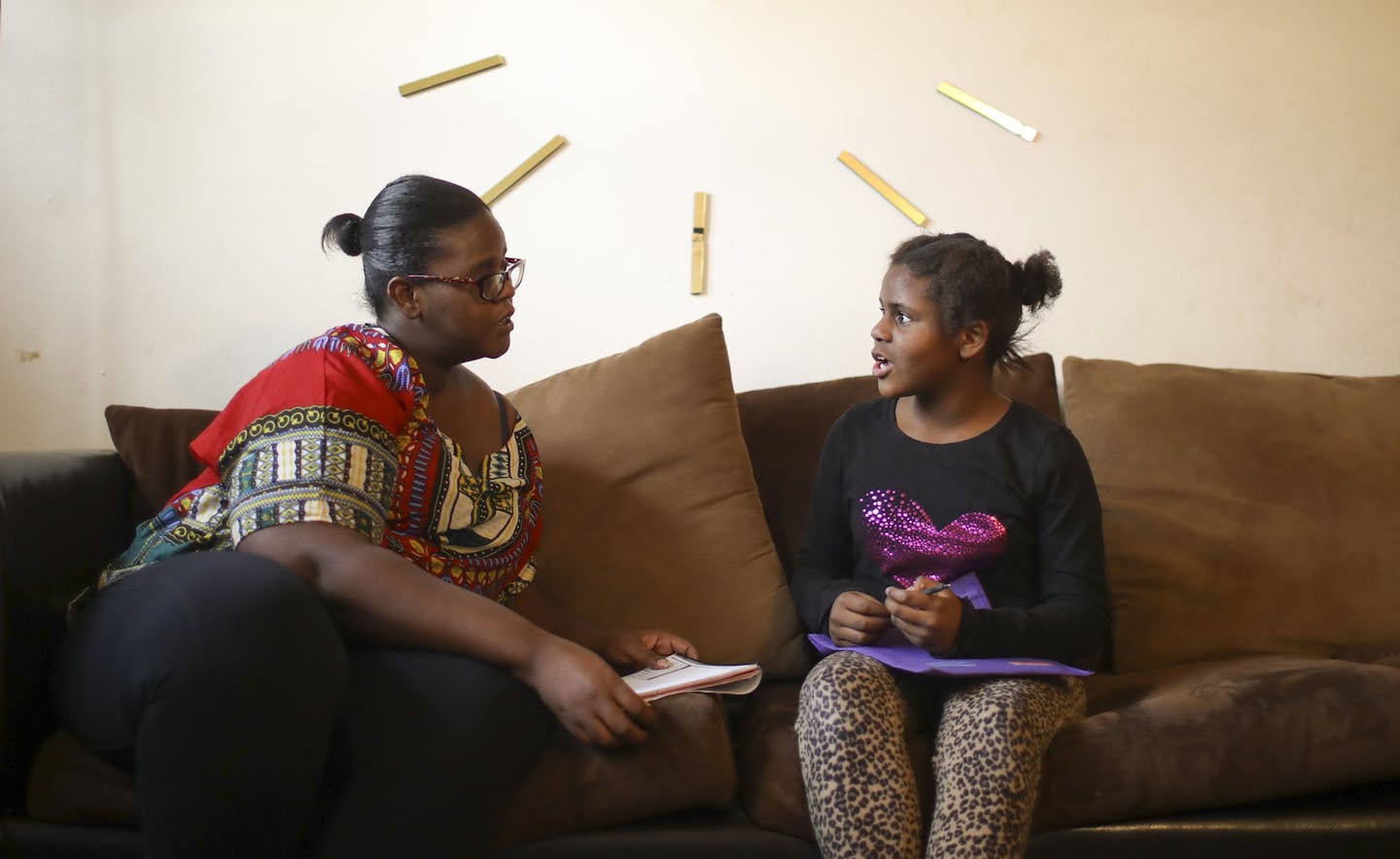 Tiffany Morgan helped her 9-year-old daughter Ny'Ana, who has fetal alcohol syndrome, with her homework after school Monday afternoon. She had to write a sentence about what she would do if she woke up and saw a dinosaur outside her window. ] JEFF WHEELER &#xef; jeff.wheeler@startribune.com Tiffany Morgan helps her 9-year-old daughter Ny'Ana, who has fetal alcohol syndrome, with her homework after school Monday afternoon, November 13, 2017, in their St. Paul apartment. Ny'Ana has struggled in sc