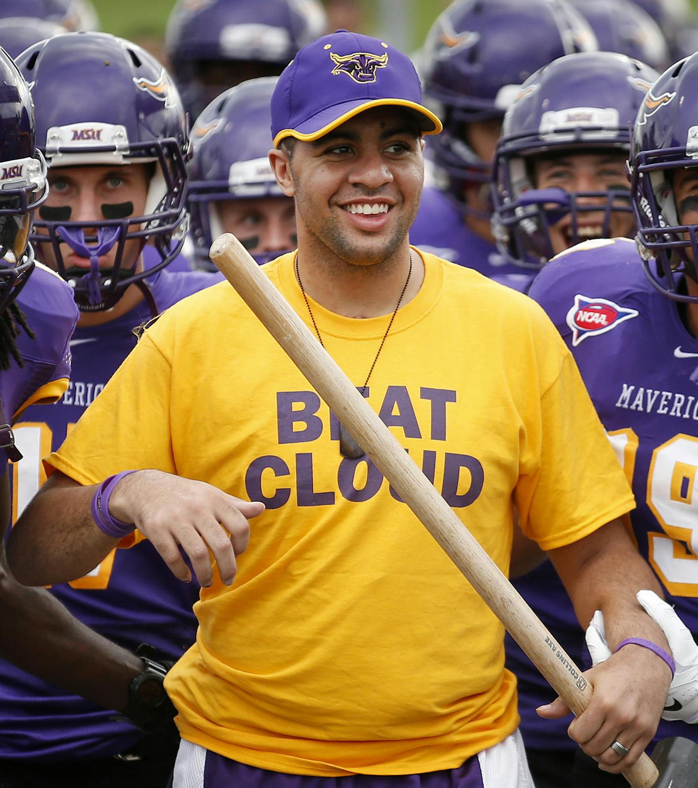 Isaac Kolstad led the Minnesota State, Mankato Mavericks football team on the field at Blakeslee Stadium before Thursday night's game vs. St. Cloud State. ] CARLOS GONZALEZ cgonzalez@startribune.com - September 4, 2014, Mankato, Minn., Minnesota State, Mankato, Blakeslee Stadium, Former Minnesota State, Mankato football player Isaac Kolstad, who was seriously injured in an assault in downtown Mankato in May, returns as honorary team captain for the Mavericks' season opener against St. Cloud Stat