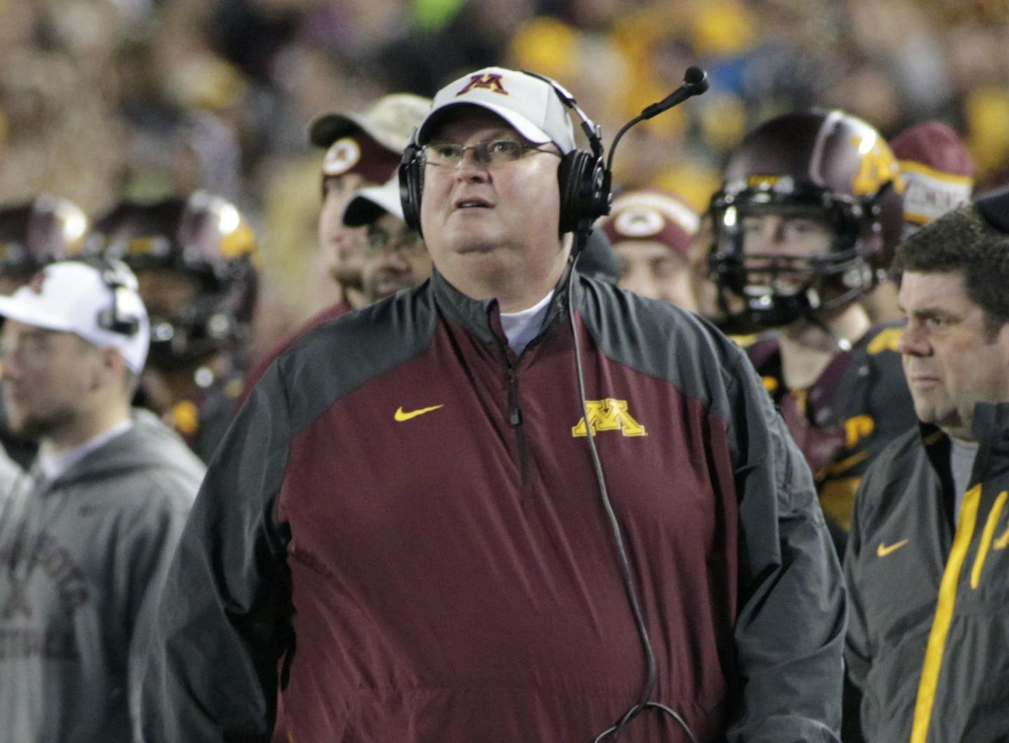 Minnesota interim head coach Tracy Claeys walks the field before a against Michigan during an NCAA college football game, Saturday, Oct. 31, 2015 in Minneapolis. (AP Photo/Paul Battaglia)