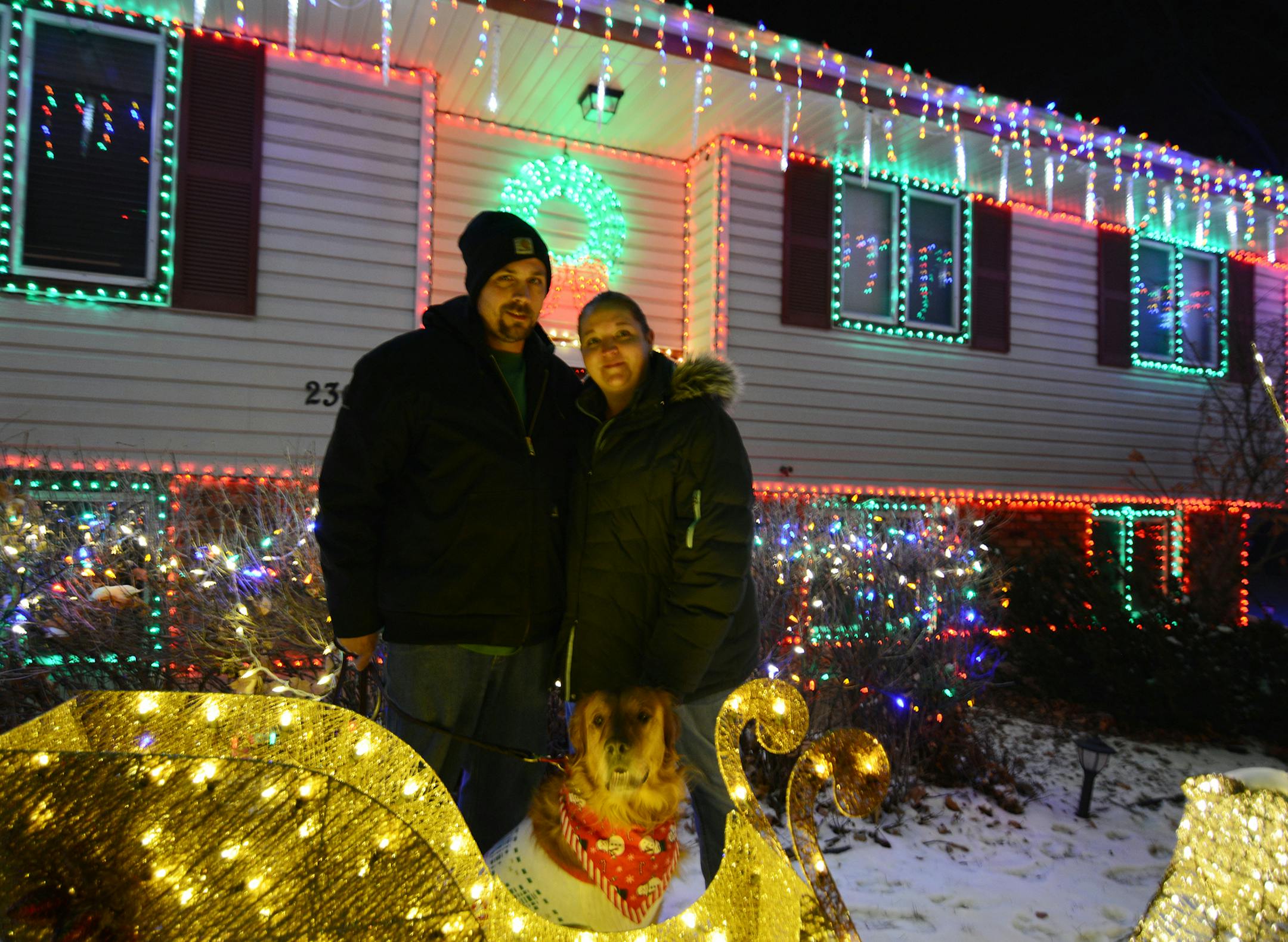 Christopher and Ingrid Danielson stood in front of their house with their dog, Prancer. The two won third place in the single family dwelling category. Photo by Liz Rolfsmeier, Special to the Star Tribune