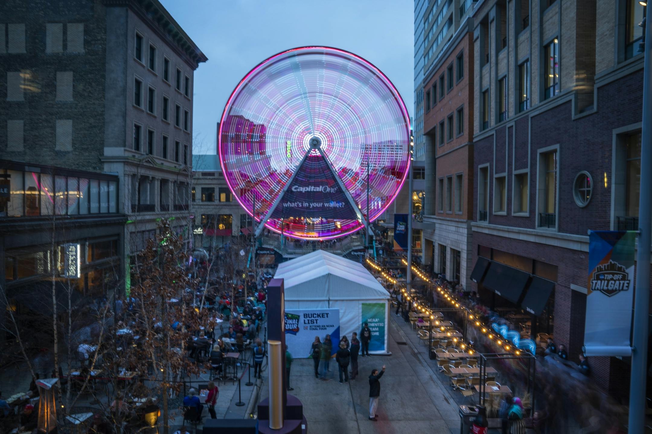 Final Four fans gather and ride the ferris wheel at the Tip-Off Tailgate at Nicollet Mall.