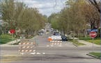 Road Closed signs were placed on Humboldt Avenue at Lowry Avenue to reduce vehicluar traffic and create a safer space for bikers and walkers.