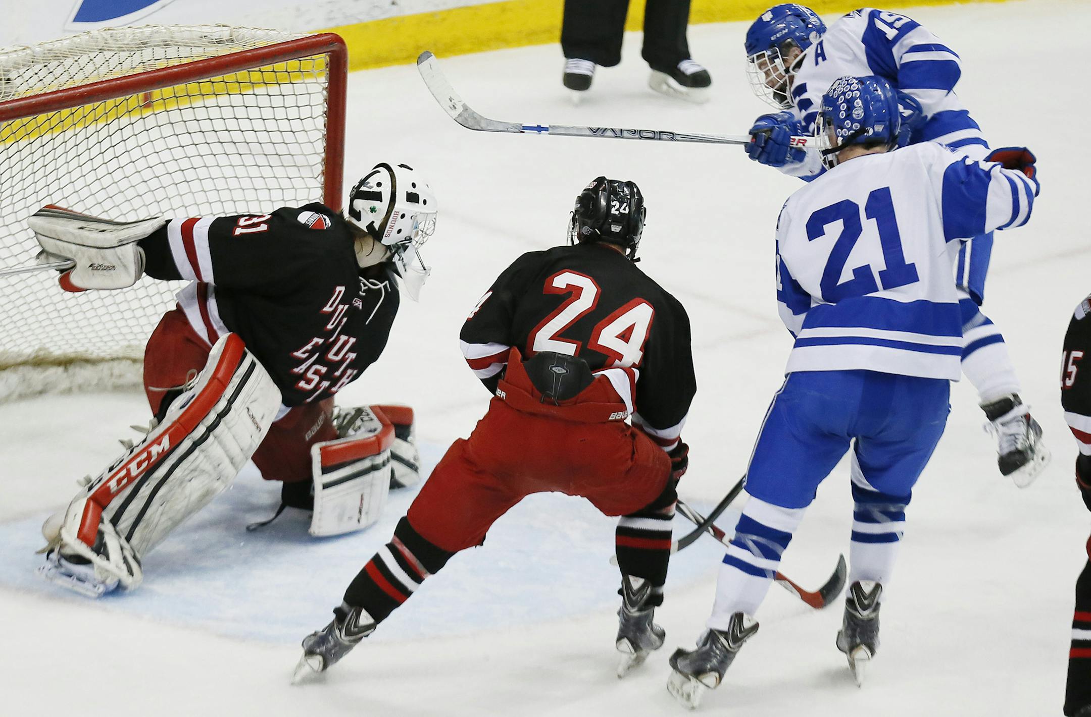 Peter Tufto of STA right scored over Duluth East goalkeeper Gunnar Howg in the second period. Duluth East played St. Thomas Academy in Class 2A quarterfinals boy's hockey state tournament at the Xcel Energy Center Thursday March 5, 2015 in St. Paul, Minnesota. ] Jerry Holt/ Jerry.Holt@Startribune.com
