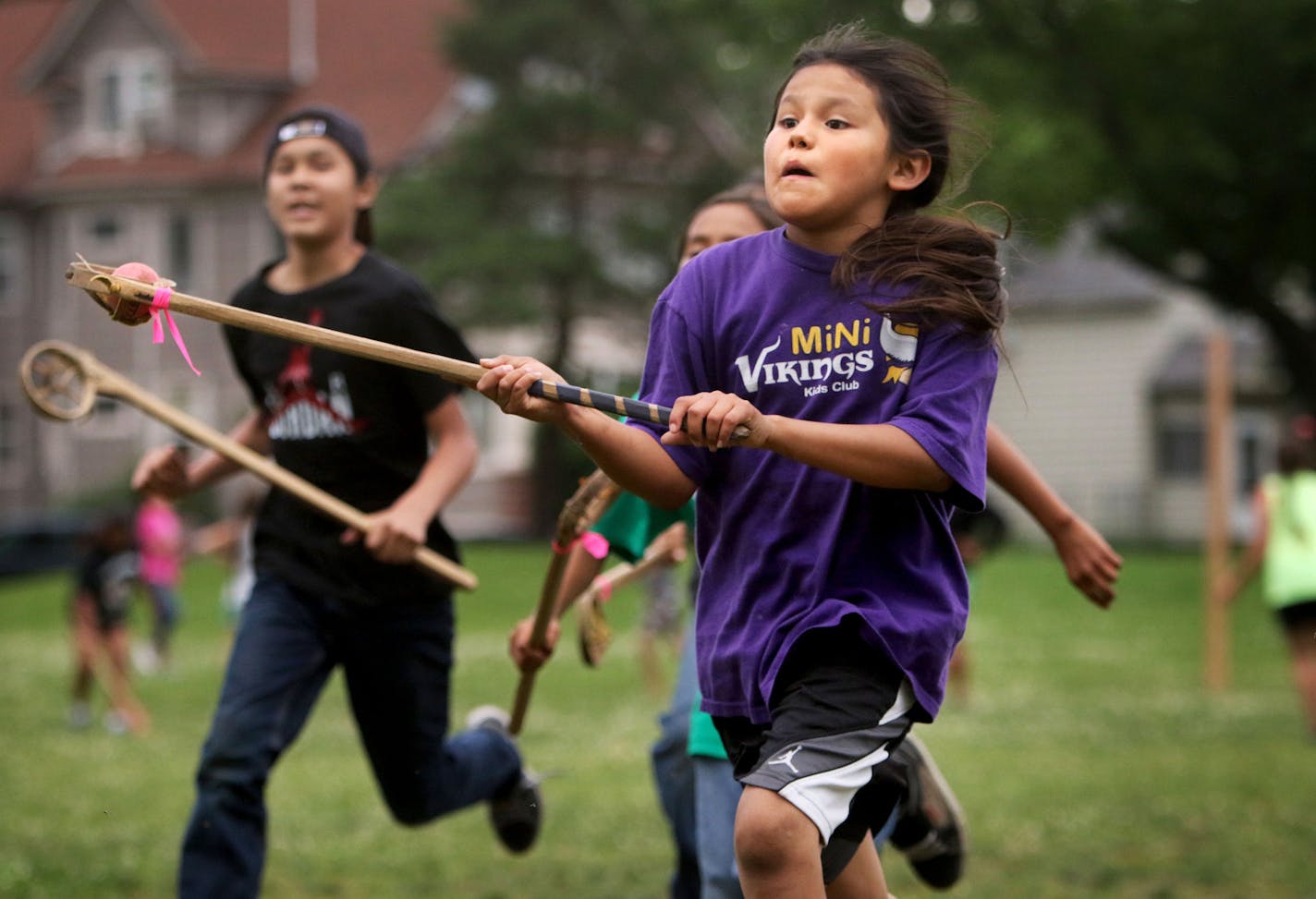 Youth members of Twin Cities Native Lacrosse practice at Corcoran Park Wednesday, June 17, 2015, in Minneapolis, MN. The traditional Lacrosse players, who play with hand carved ash sticks, were preparing for the upcoming Twin Cities Native Lacrosse Tournament at the Osseo High School Saturday. Here, Dalon DeCory, front, looks to score while being defended by Bronson Grant, left to right, and Santino DeCory.](DAVID JOLES/STARTRIBUNE)djoles@startribune.com Though the sport of lacrosse was originat